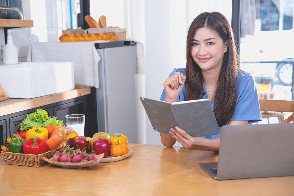 A Young Woman With A Beautiful Face In A Blue Shirt With Long Ha A Young Woman With A Beautiful Face In A Blue Shirt