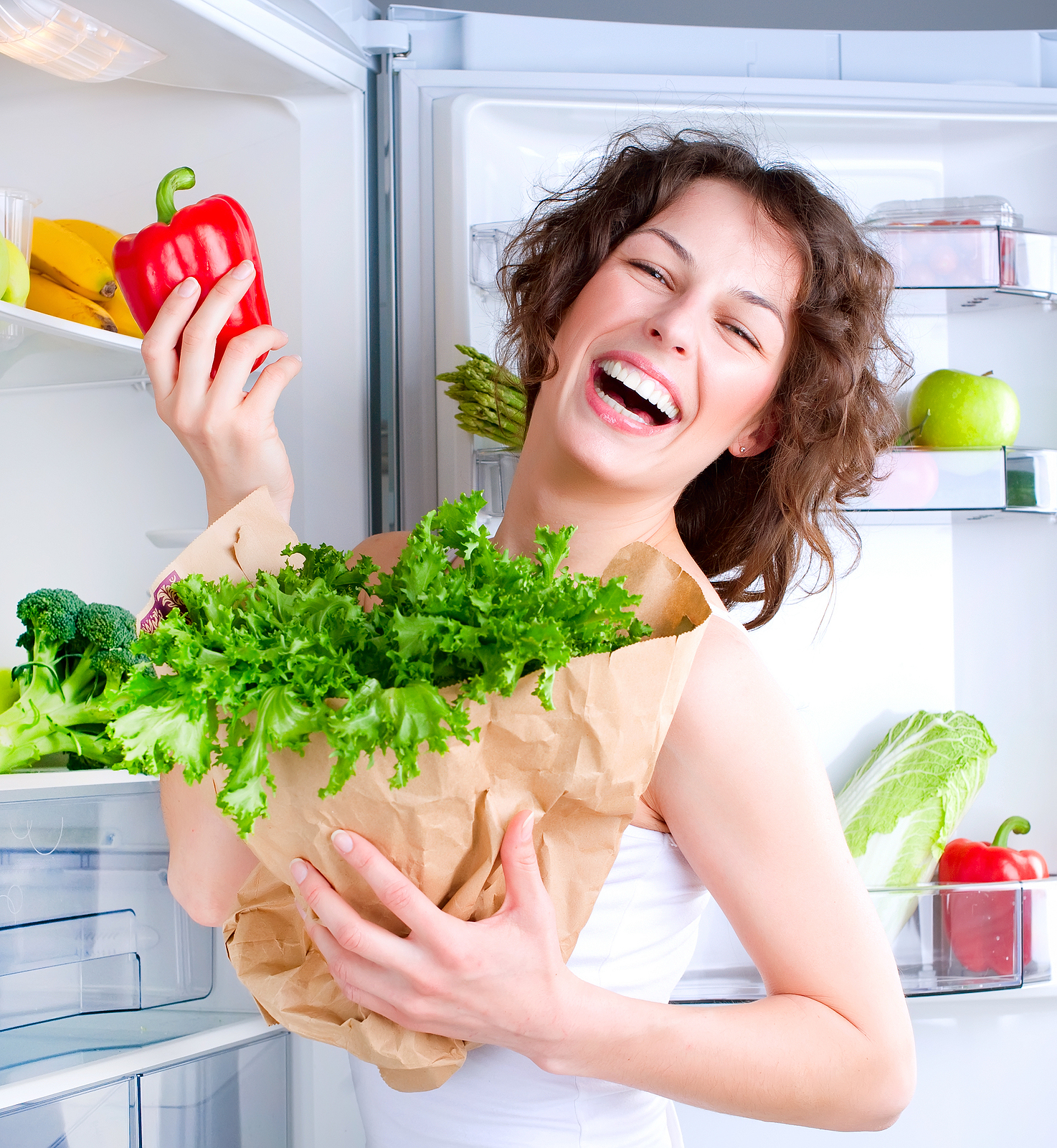 Dieting concept .Diet. Beautiful Young Woman near the Refrigerat Dieting concept